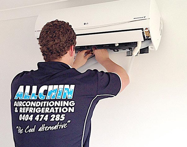 Repairman fixing aircon — Air-Conditioning and Refrigeration in Sunshine Coast, QLD