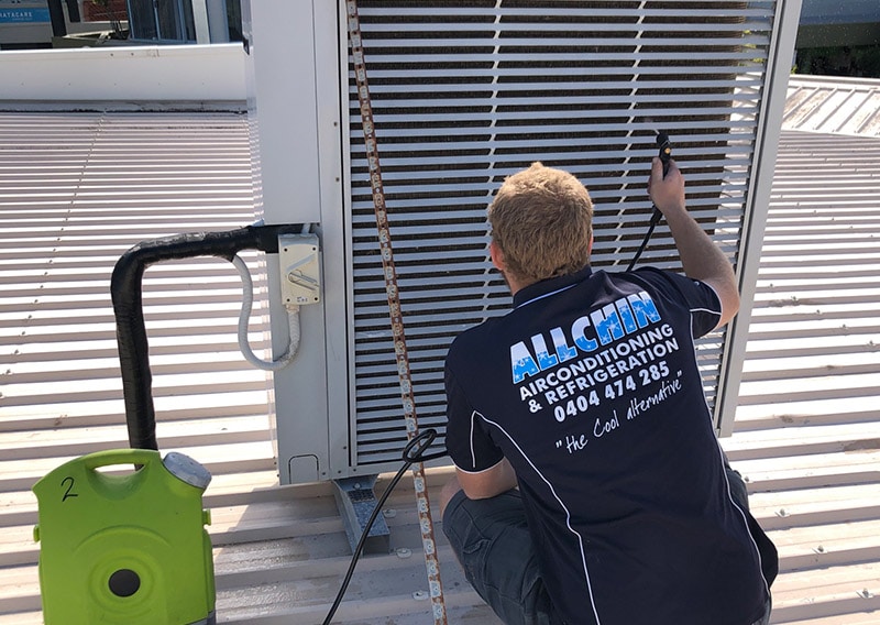Man Checking the Commercial Air-Conditioning Unit — Air-Conditioning and Refrigeration in Sunshine Coast, QLD