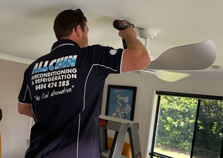Technician Installing Ceiling Fan — Air-Conditioning and Refrigeration in Sunshine Coast, QLD