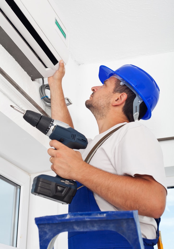 Worker installing air conditioning — Air-Conditioning and Refrigeration in Currimundi, QLD