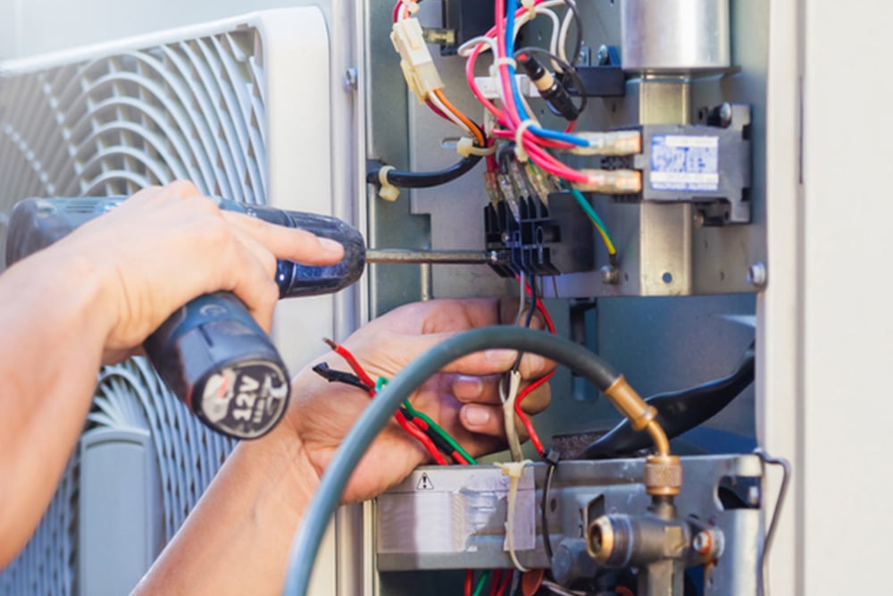 Technician hands using a screwdriver — Air-Conditioning and Refrigeration in Maroochydore, QLD